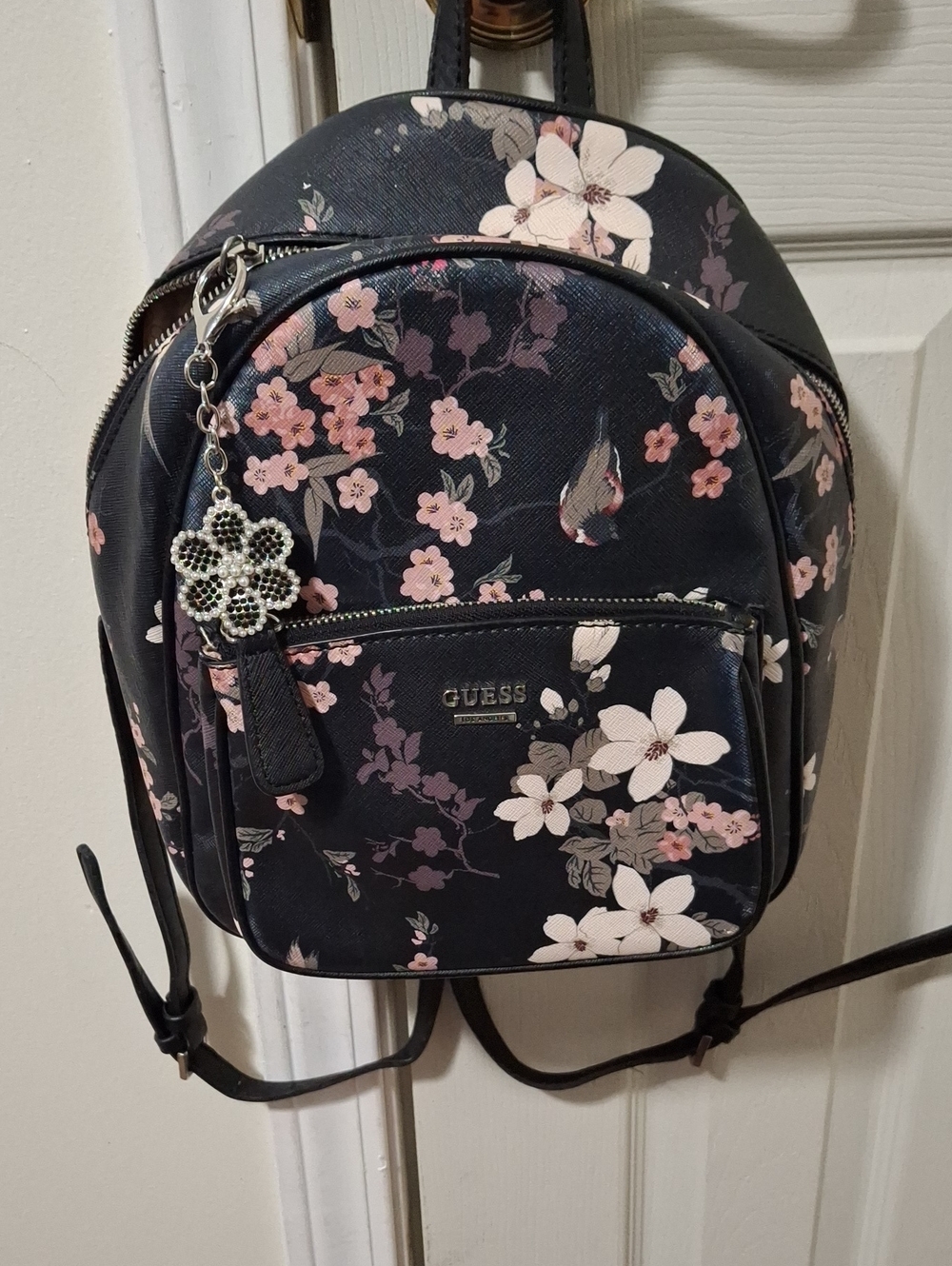 GUESS Black Floral Mini Backpack with Decorative Floral Zipper Pull